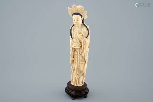 A Chinese carved ivory figure of Guanyion on wooden base, early 20th C.
