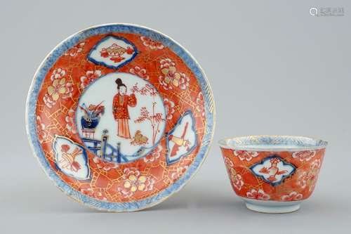 A Chinese blue and white on coral ground cup and saucer, Kangxi