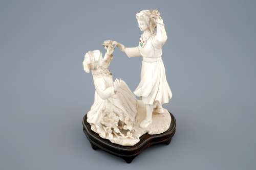A Chinese carved ivory group with dancing girls, 2nd quarter 20th C.