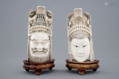 A pair of Chinese carved ivory faces on wooden stands, 19th C.