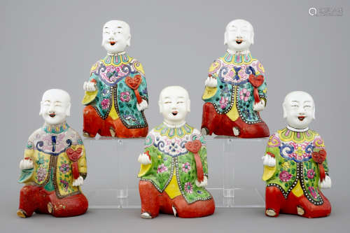 A set of 6 Chinese famille rose figures of laughing boys, 19th C.