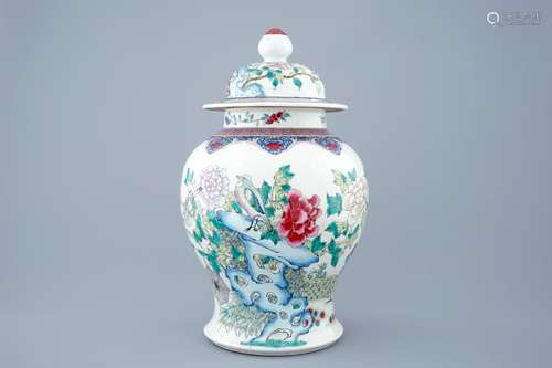 A fine Chinese famille rose vase and cover with birds among flowers, 19th C.