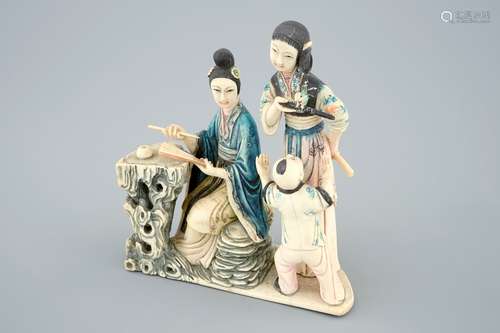 A Chinese polychrome carved ivory group of a lady with children, 19/20th C.