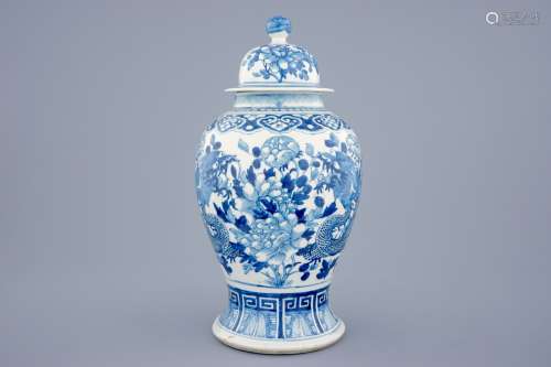 A Chinese blue and white vase and cover with dragons and peonies, 19th C.