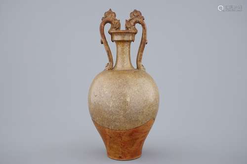 A Chinese stoneware amphora vase with dragon handles, Tang dynasty, 7th C.