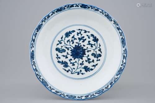 A Chinese blue and white Ming style lotus scroll plate, Qianlong mark and of the period