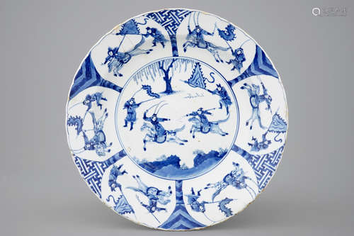 A Chinese blue and white dish with a battle scene on horseback, Kangxi