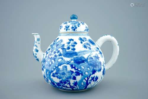 A large Chinese blue and white teapot and cover with peacocks, Kangxi