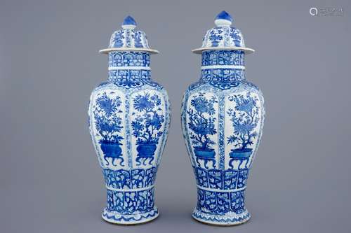 A pair of large Chinese blue and white vases and covers, Kangxi