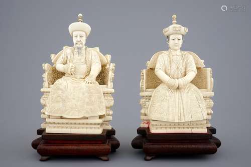 A pair of Chinese ivory figures of the emperor couple seated on a throne, ca. 1900