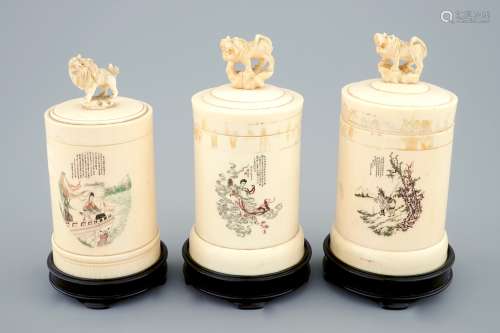 Three Chinese inscribed and decorated ivory cylindrical boxes with covers, early 20th C.