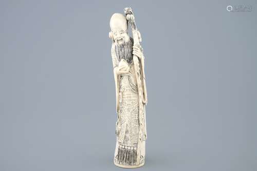 A tall Chinese carved ivory figure of Shou Lao, late 19th C.