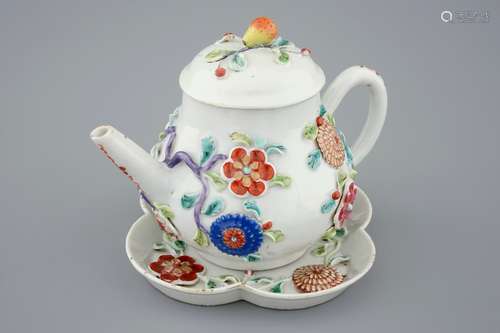 A Chinese moulded and applied famille rose teapot and cover on stand, Yongzheng, 1723-1735