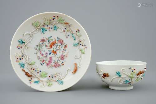 A Chinese relief-decorated famille rose cup and saucer with squirrels, Yongzheng, 1723-1735