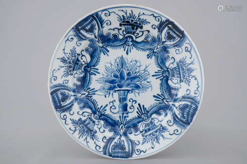 A Chinese blue and white plate after a Dutch Delft example, Qianlong, 18th C.