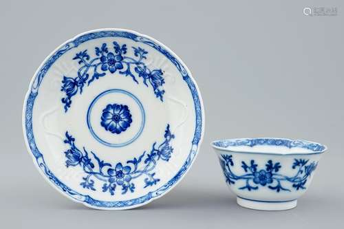 A Chinese blue and white soft paste  moulded cup and saucer, Qianlong, 18th C.