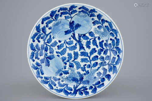 A Chinese blue and white dish with sanduo fruits among foliage, Kangxi