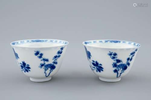 A pair of Chinese blue and white wine cups with 4 floral patterns, six-character mark, Kangxi