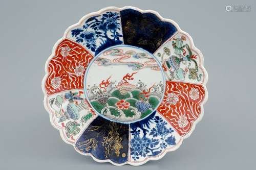 A lobed Chinese famille verte plate with shells among waves, Kangxi