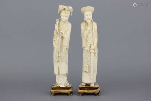 A pair of Chinese carved ivory figures of the emperor couple, 19/20th C.