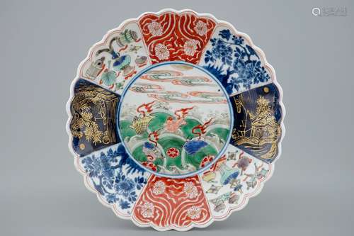 A lobed Chinese famille verte plate with shells among waves, Kangxi