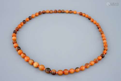 A Chinese rhino horn beads necklace, 19th C.