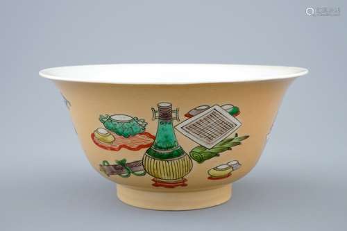 A Chinese famille verte café au lait ground bowl with precious objects, Kangxi