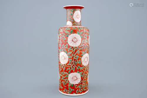 A Chinese famille verte coral-ground rouleau vase with peony scrolls, Kangxi