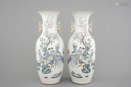 A tall pair of Chinese famille rose vases with beauties in a garden, 19th C.