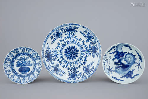 A large Chinese blue and white floral charger and two plates, Kangxi