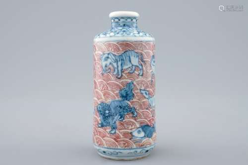 An unusual Chinese blue, white and underglaze red snuff bottle with animals, 18/19th C.