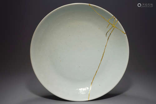 A Chinese underglaze design white monochrome dish, Kangxi