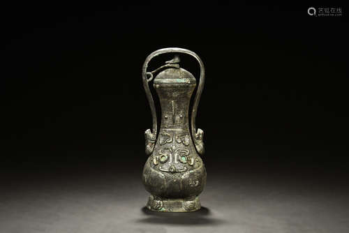 ARCHAIC BRONZE CAST RITUAL EWER WITH COVER