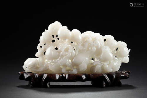 WHITE JADE CARVED 'AUSPICIOUS FRUITS' FIGURE