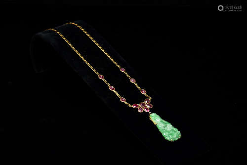 18K YELLOW GOLD AND RUBY NECKLACE WITH JADEITE CARVED GUANYIN PENDANT