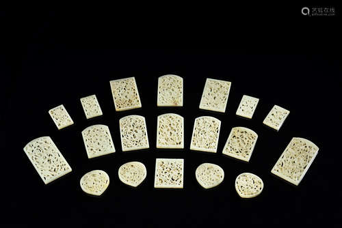 SET OF NINETEEN WHITE JADE OPENWORK CARVED PLAQUES