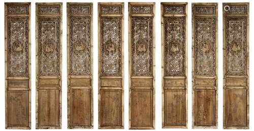 A set of eight wood door panels