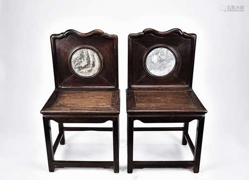 A pair of hardwood chair inset with marble