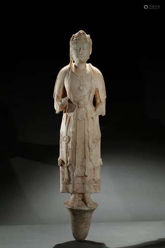 A tall marble carved figure of bodhisattva