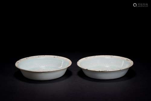 A pair of celadon glazed dishes