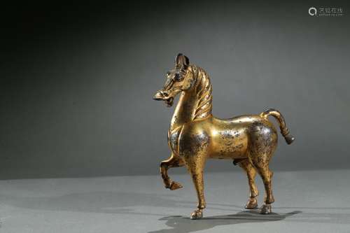 A gilt bronze cast model of horse