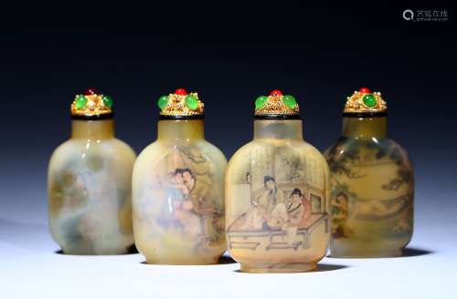 A set of four inside-painted crystal snuff bottles
