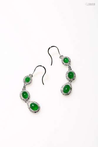 An intense emerald green jadeite jade and diamond Earring