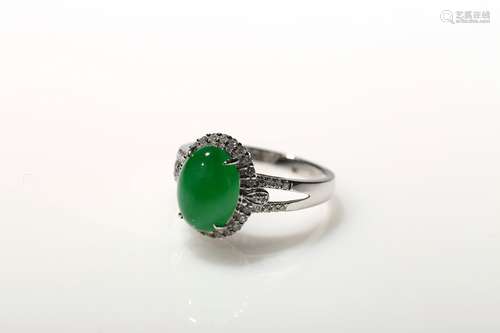 A bright apple green jadeite ring