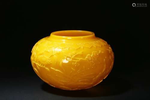 An egg-yolk yellow glass flowers jar