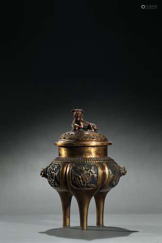 A large parcel-gilt tripod censer