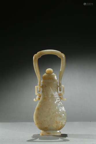 A white jade 'archaistic beast' hu with handle