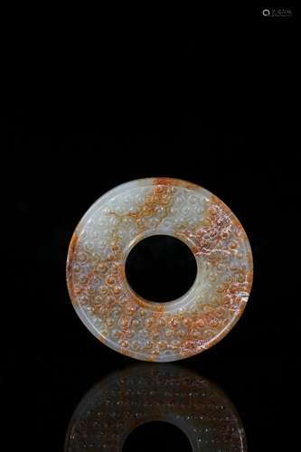 A mottled white and russet jade disc bi