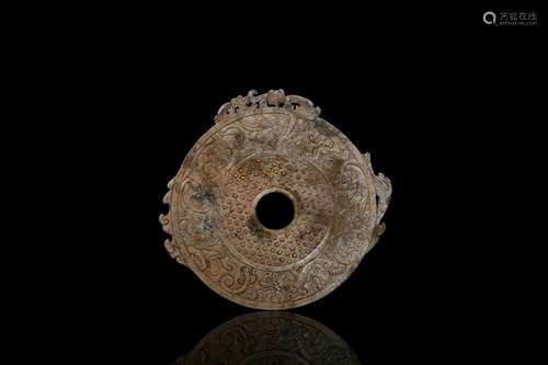 An archaic jade 'mythical beasts' ornament disc bi