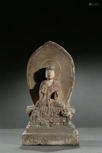 A stone carved polychromed 'buddhist' stele
